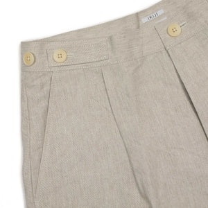 Relaxed pleated trousers in ivory paper and linen
