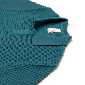 Bubble-knit short sleeve polo shirt in petrol blue cotton