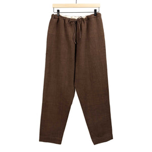 11.11 / eleven eleven - Drawstring tapered trousers in burnt umber cotton basketweave - $295.00