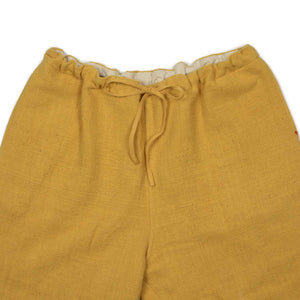 Drawstring tapered trousers in mango yellow cotton basketweave