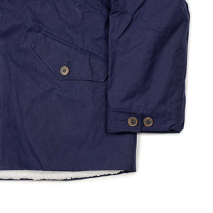 A Jacket in navy English dry waxed cotton with teddy lining