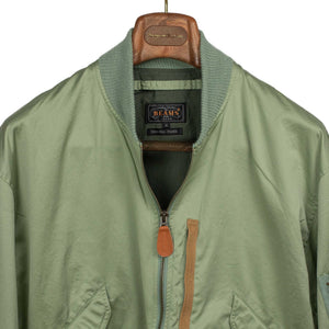 Relaxed military bomber in sage cotton sateen