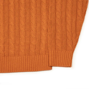 Crewneck cable knit sweater in orange linen and cotton