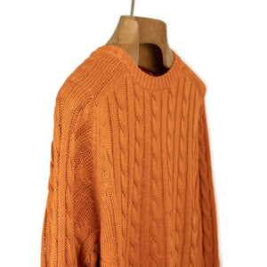 Crewneck cable knit sweater in orange linen and cotton