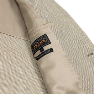 Single-breasted relaxed jacket in ivory houndstooth linen and cupro