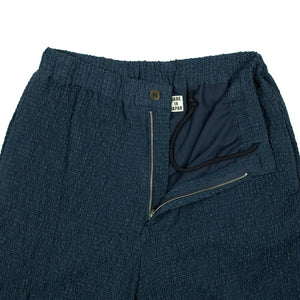 Drawstring trousers in shirred indigo-dyed cupro