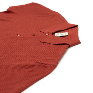 Knit short sleeve polo in brick red mini diamond pattern cotton
