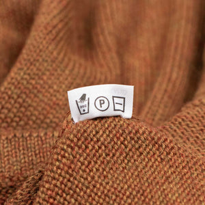 Long sleeve saddle shoulder polo in Rust Marl alpaca and silk