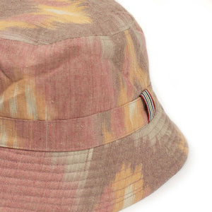 Quilted reversible bucket hat in red, grey and ochre Ikat cotton