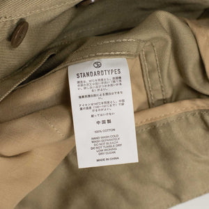 Pleated side tab chinos in beige cotton twill