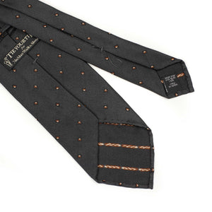 Charcoal grey subtle herringbone silk tie, rust and white jacquard square dots