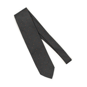 Charcoal grey subtle herringbone silk tie, rust and white jacquard square dots