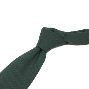 Solid tie in dark green wool seersucker