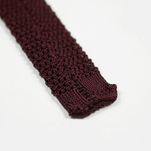 Burgundy square bottom silk knit tie, hand-sewn grey dots