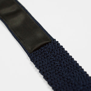 Navy square bottom silk knit tie, hand-sewn yellow dots