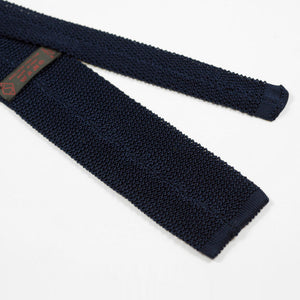 Navy square bottom silk knit tie, hand-sewn yellow dots