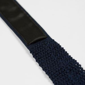 Navy square bottom silk knit tie, hand-sewn grey dots
