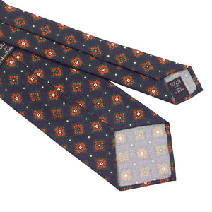 Navy silk foulard tie with green and orange medallion print, hand-rolled & untipped