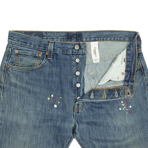 Vintage Levis 501 jeans with embroidered paint splatter, medium wash