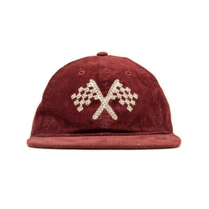 Corduroy cap in crimson with racing flag chainstitched embroidery
