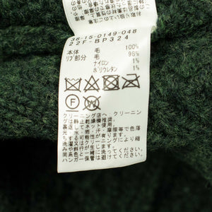 Crazy cable knit Aran cardigan in racing green wool