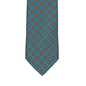 Hand-printed slate blue silk twill tie, rust and olive medallion print