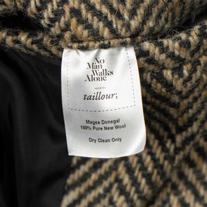 Belted balmacaan coat in handloomed Donegal oatmeal-black herringbone tweed