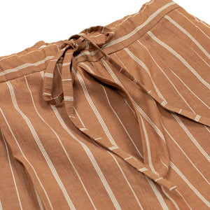 Pleated drawstring trousers in burnt orange and white striped cotton/linen