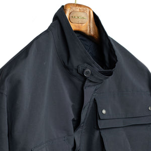 Photographer jacket in navy water-resistant polyester and paper