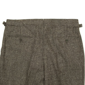 x Sartoria Carrara: Pleated trousers in tonal charcoal Prince-of-Wales undyed wool