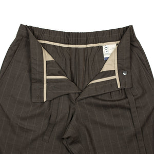 x No Man Walks Alone: Drawstring easy pants in deadstock ebony striped tropical wool