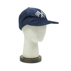 Corduroy cap in navy with racing flag chainstitched embroidery