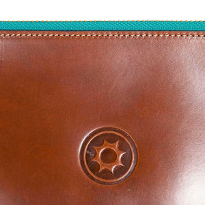 Brown leather portfolio with green zipper