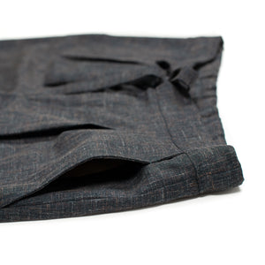 x No Man Walks Alone: Drawstring trousers in deadstock speckled charcoal wool and linen